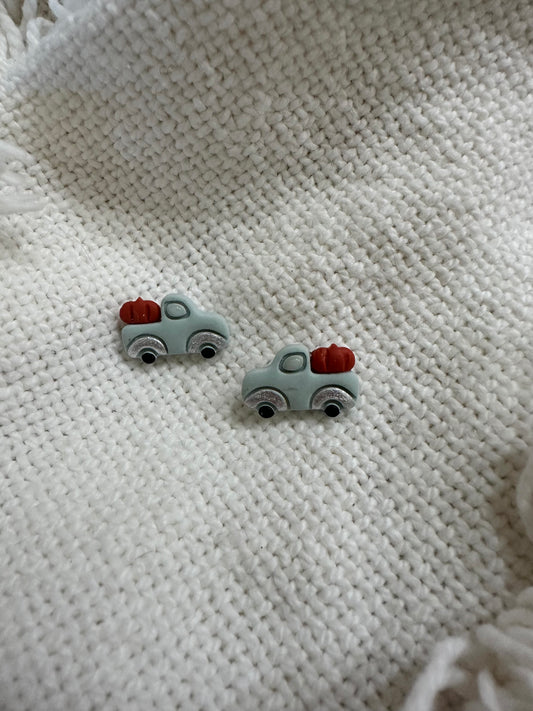 Pickup Hauling a Pumpkin Studs